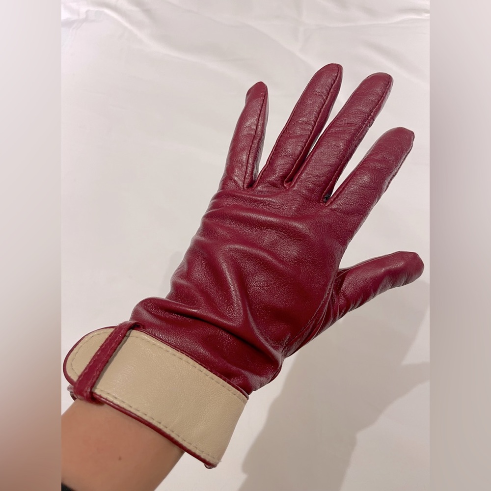 Red leather gloves ladies size small.  Lined. Cream cuff detail.